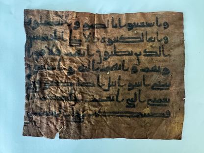 Quran manuscript on leather written by Abu Bakr RA certified