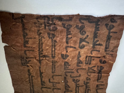 Quran manuscript on leather written by Abu Bakr RA certified