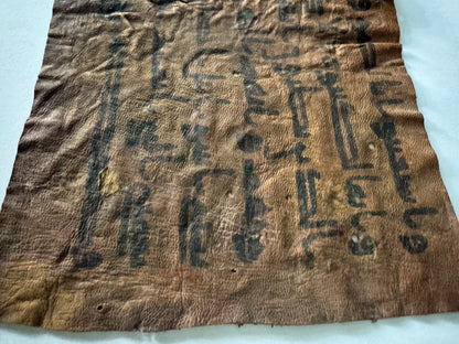 Quran manuscript on leather written by Abu Bakr RA certified